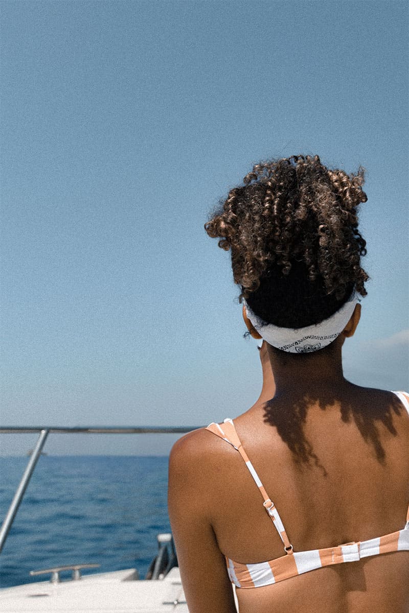 woman enjoying the view on a yacht