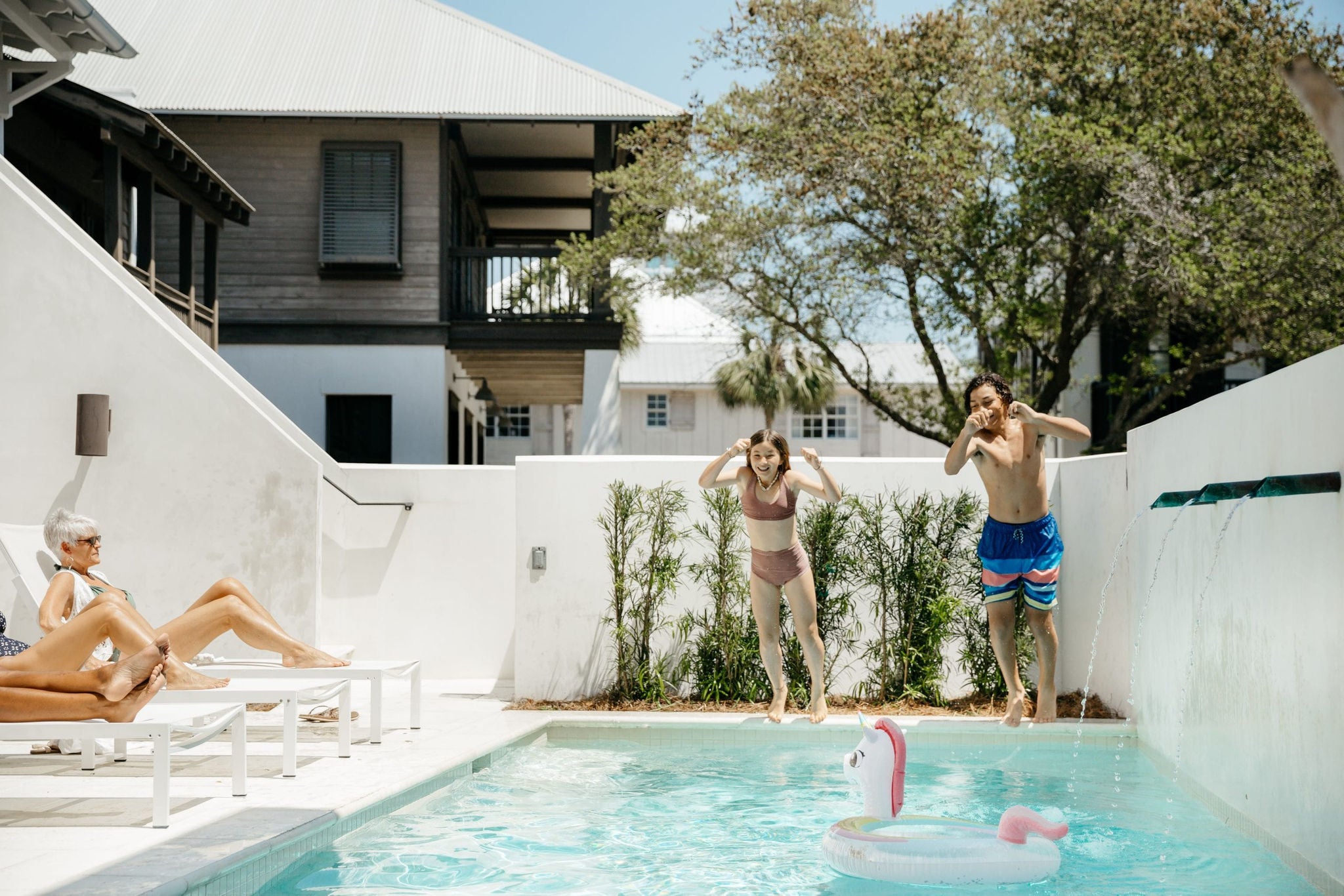 kids jumping in pool