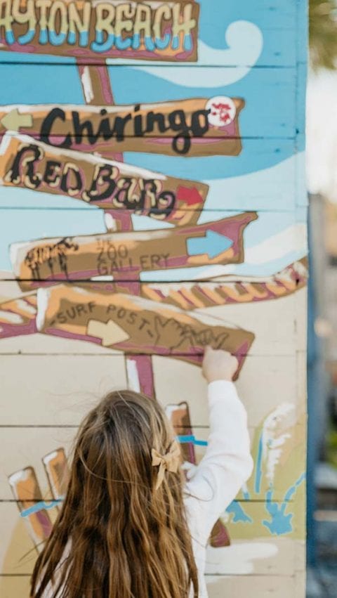 girl at grayton signs