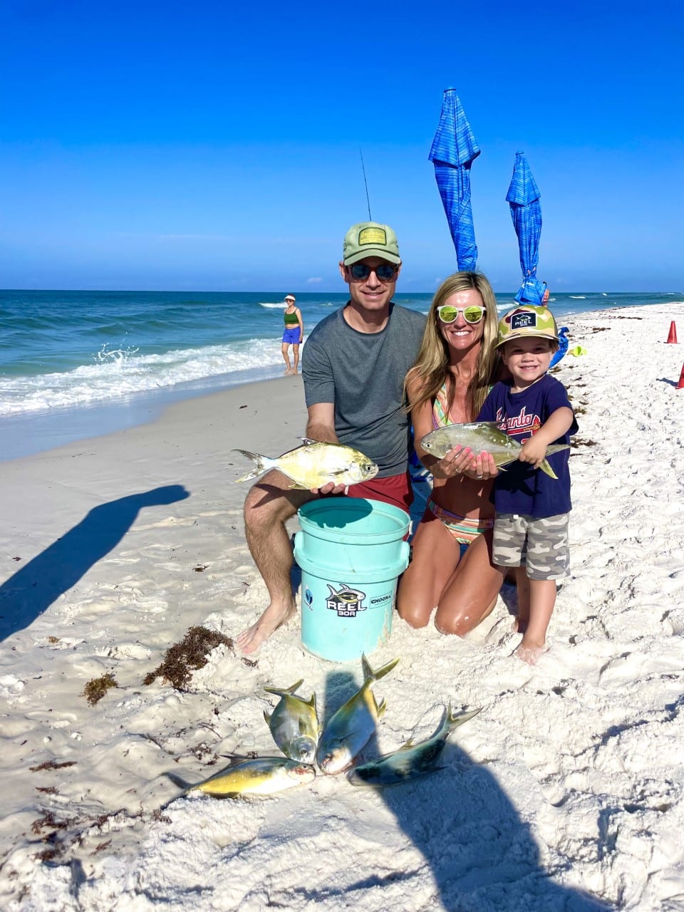 family holding fish