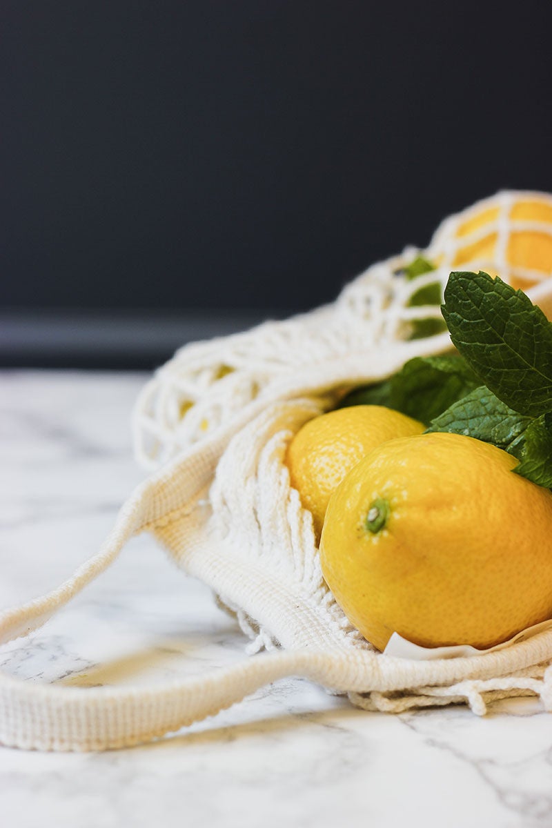 bag of fresh lemons on kitchen counter