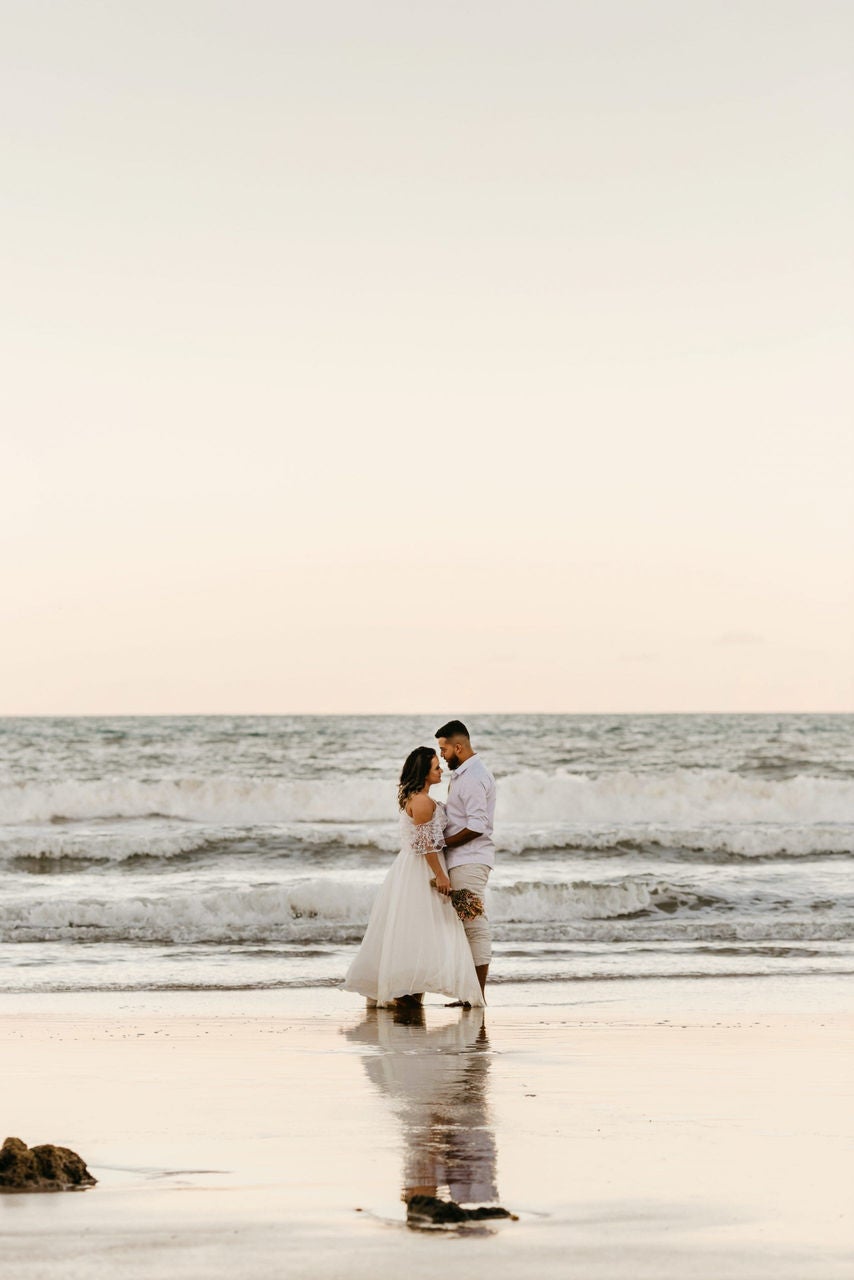couple on the beach wedding dress